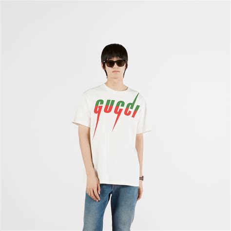 gucci maglio con stampa|GUCCI Maglia bianca con stampe logo .